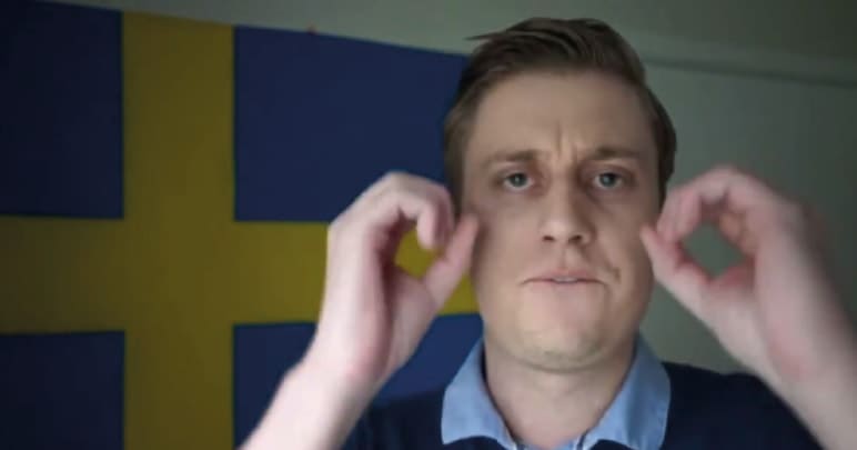 Right-wing activist Peter Sweden with his hands held up making circles