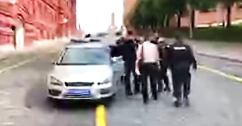 An image from Peter Tachells arrest at the start of the World Cup