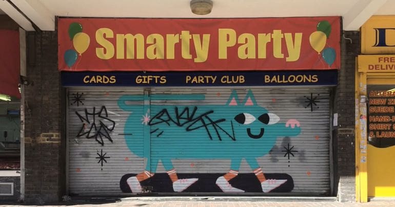 A boarded up shop in Chrisp street market