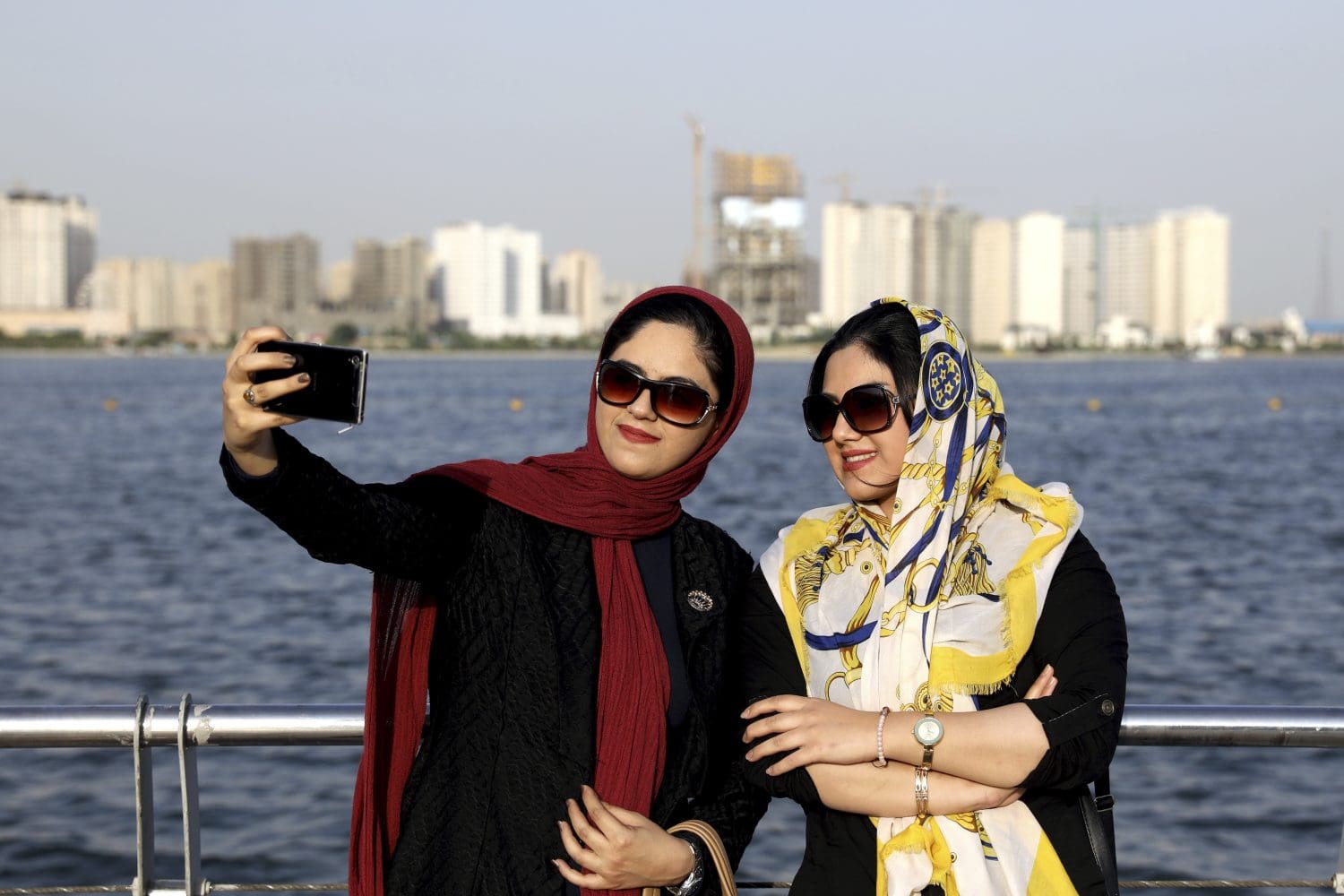 Some Iranian women taking off hijabs as hardliners push back on dress code