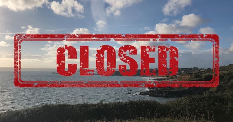 Coast in Cornwall with a closed sign