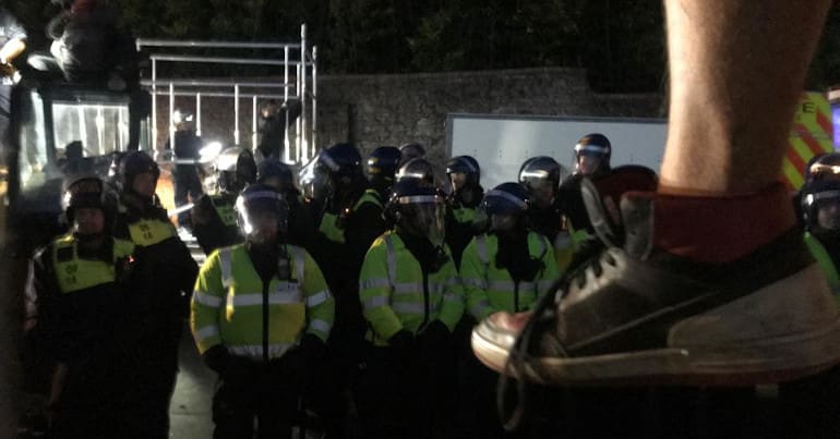 A JCB is occupied as bailiffs attempt to evict a traveller siite in Bristol