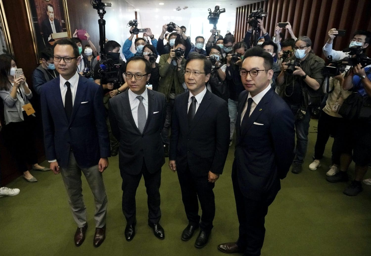 Hong Kong disqualifies four pro-democracy legislators