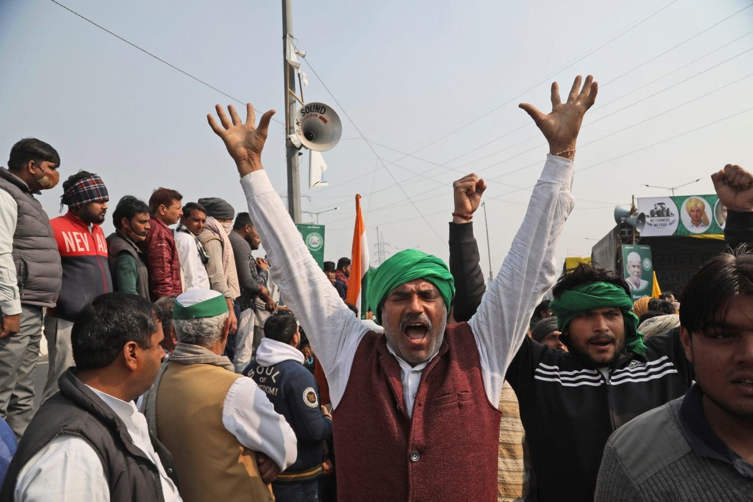 An Indian protester raising his hands