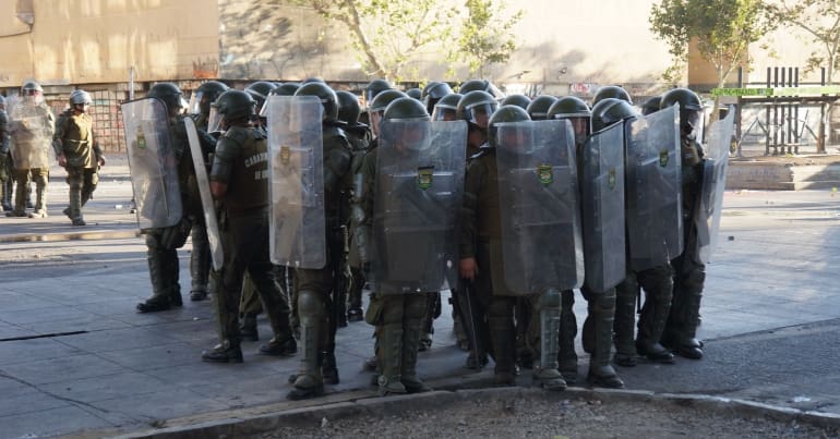 Chile police with riot shields