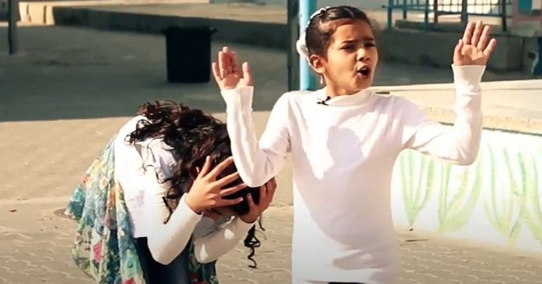 Two Palestinian children performing a play