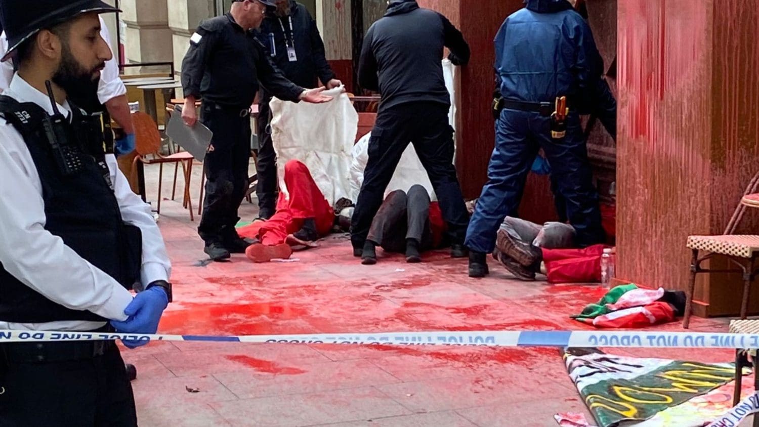 Four Palestine Action protesters arrested after covering London arms firm HQ in paint