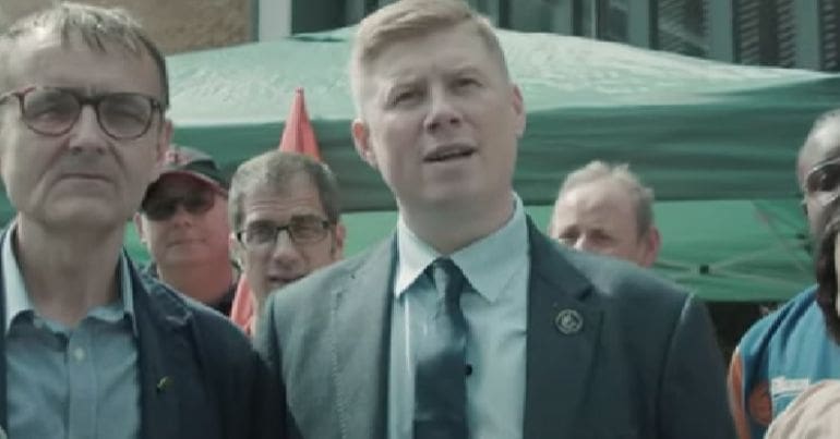 Eddie Dempsey speaks at a rally.