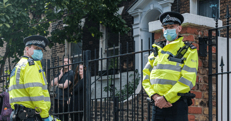 two police officers look at the camera