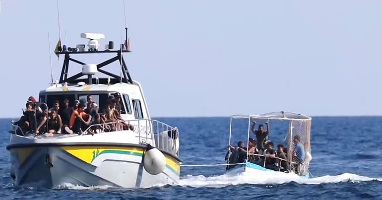 Refugees in a boat off the Italian coast as more have died coming from Libya