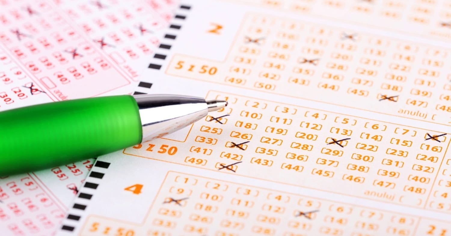 UK gambling lottery ticket and pen