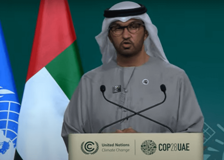 COP28 president sultan Al Jaber standing at the podium during the closing plenary of the summit.