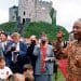 Nelson Mandela in front of a castle in Wales