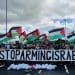 Stop Arming Israel banner being held by people outside Elbit factory in Bristol