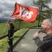 A girl holding a YesCymru flag and its new chair Phyl Griffiths Wales