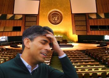 UN general assembly hall with Rishi Sunak inside holding his head with his hand UK government UNCRPD