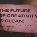 Banner that reads: "The future of creativity is clean" with confetti falling all around it. ad agencies fossil fuels