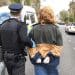 Activist being led away by a cop Starmer