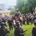 US students protest Greece line of cops