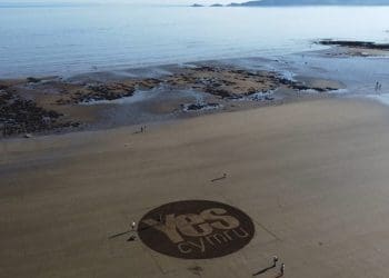 YesCymru logo on Wales beach Crown Estate Welsh Independence