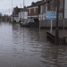 Flooding down a UK residential street climate insurance weather