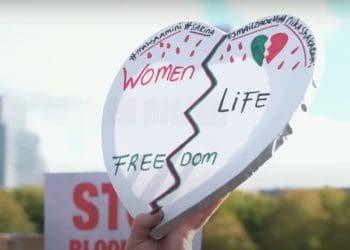 Heart-shaped placard reads: "Women Life Freedom". Iran's executions Iran