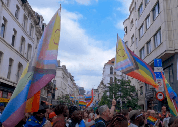 Brussels Pride parade march down the streets with multiple flags Europe LGBTQ+ report