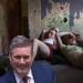 Two young girls lying on the floor. A laughing Keir Starmer in front two-child limit Labour