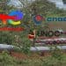 EACOP project mid-construction through jungle. TotalEnergies, CNOOC, and UNOC logos.