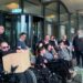 Disabled people protesting outside Portcullis House over the DWP