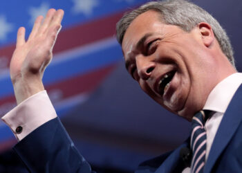 Nigel Farage waving Reform