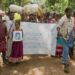 Jenu Kuruba families begin their long-awaited re-occupation of their ancestral homes inside the Nagarhole National Park. They carried photos of loved ones who had died after the village was evicted, so they too can return to the forest.