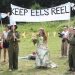 Activists hold a wedding ceremony, with fish-shaped placards, eel costumes, and a banner that reads "Keeps eels reel" World Water Weddings