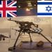 A machine gun, the Union Jack, and the Israel flag DSEI
