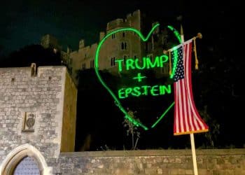 Green heart projection on Windsor Castle reads: "Trump + Epstein"