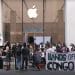 Group of protesters stand outside an Apple store with a banner that reads: "Hands off Congo" iPhone 17
