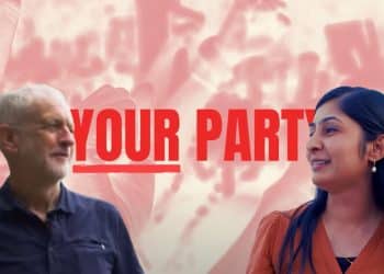 Jeremy Corbyn on left corner of image, Zarah Sultana on right corner of the image, with Your Party logo and backdrop of raised fists behind them.