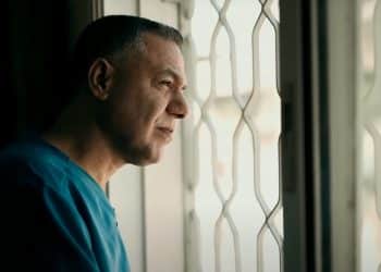 Dr Hussam Abu Safiya stares out a window at Kamal Adwan Hospital before the Israeli occupation forces abducted him.