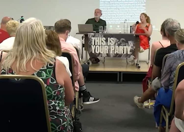 Your Party meeting with lots of people sat together.