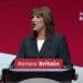 Chancellor Rachel Reeves stands at the 'Renew Britain' podium at Labour's conference, delivering her speech youth guarantee