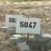 Cemeteries of numbers - graves marked with numbers 5047 and surrounded by bricks Israel