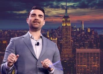Ben Shapiro standing in front of the New York skyline