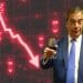 Nigel Farage drinking sherry in front of a big red line pointing down