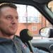 Tommy Robinson in a car